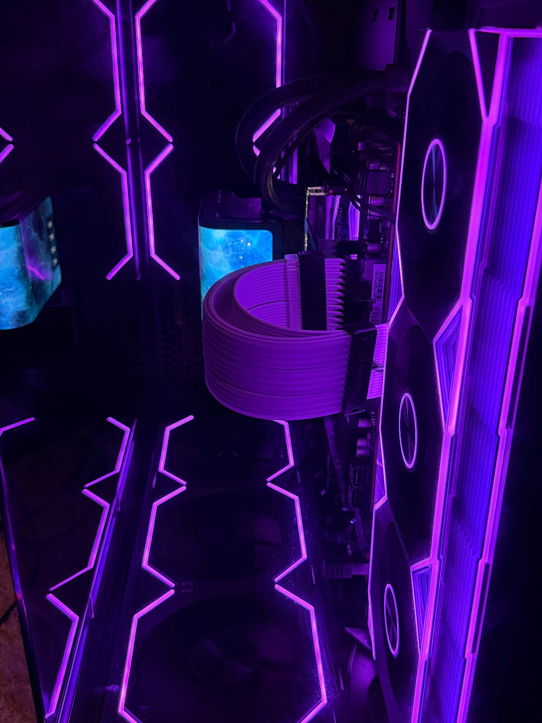 Purple-lit PC cable routing detail